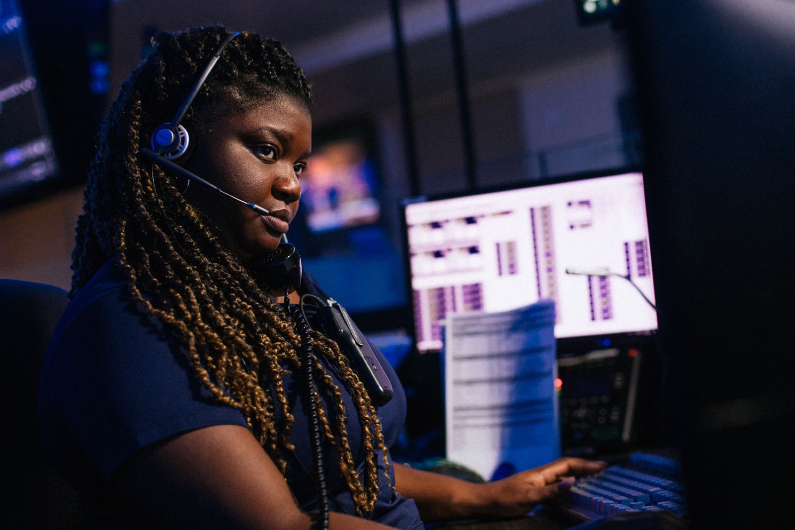 Emergency dispatcher at a communications console